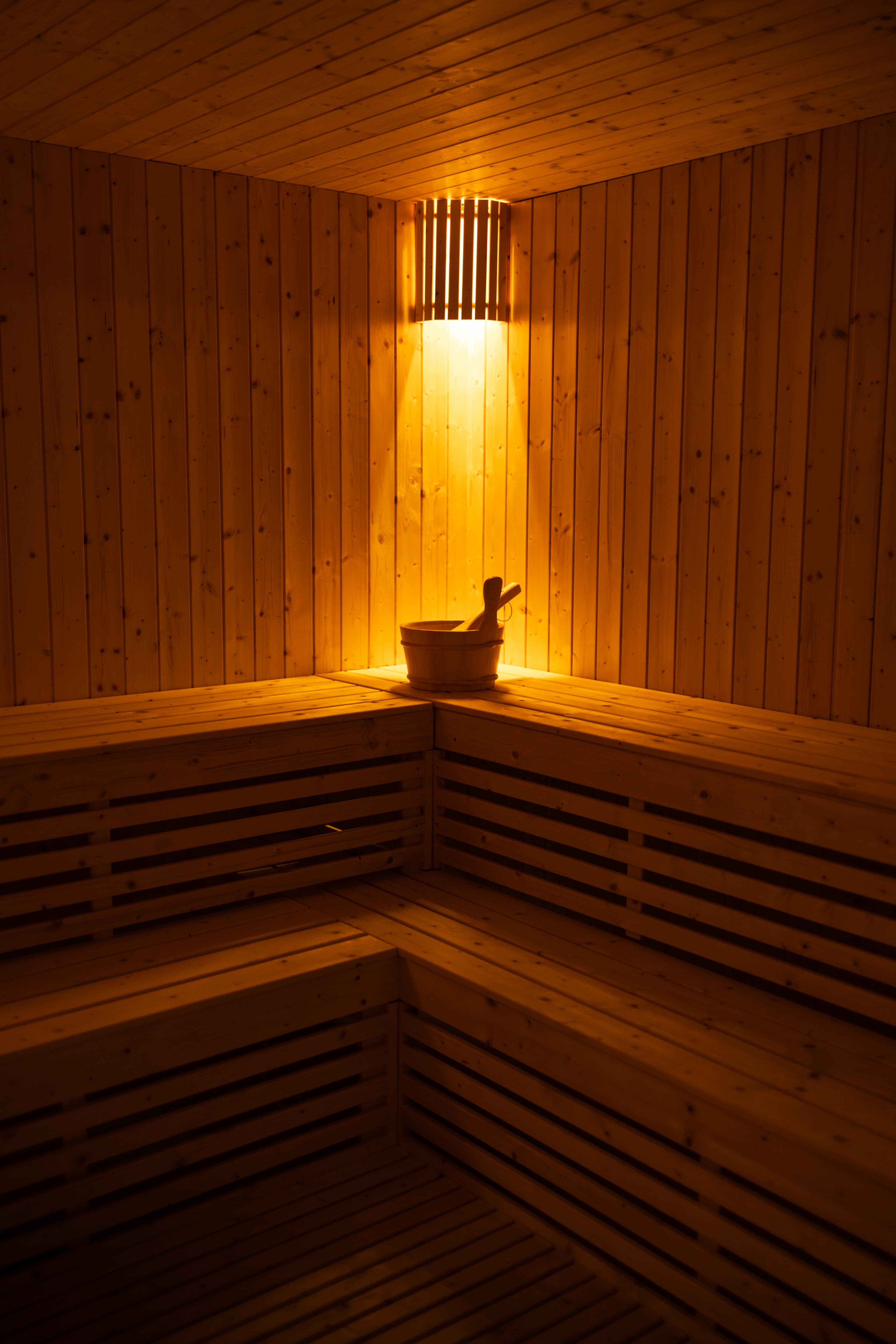 Wooden sauna interior softly lit