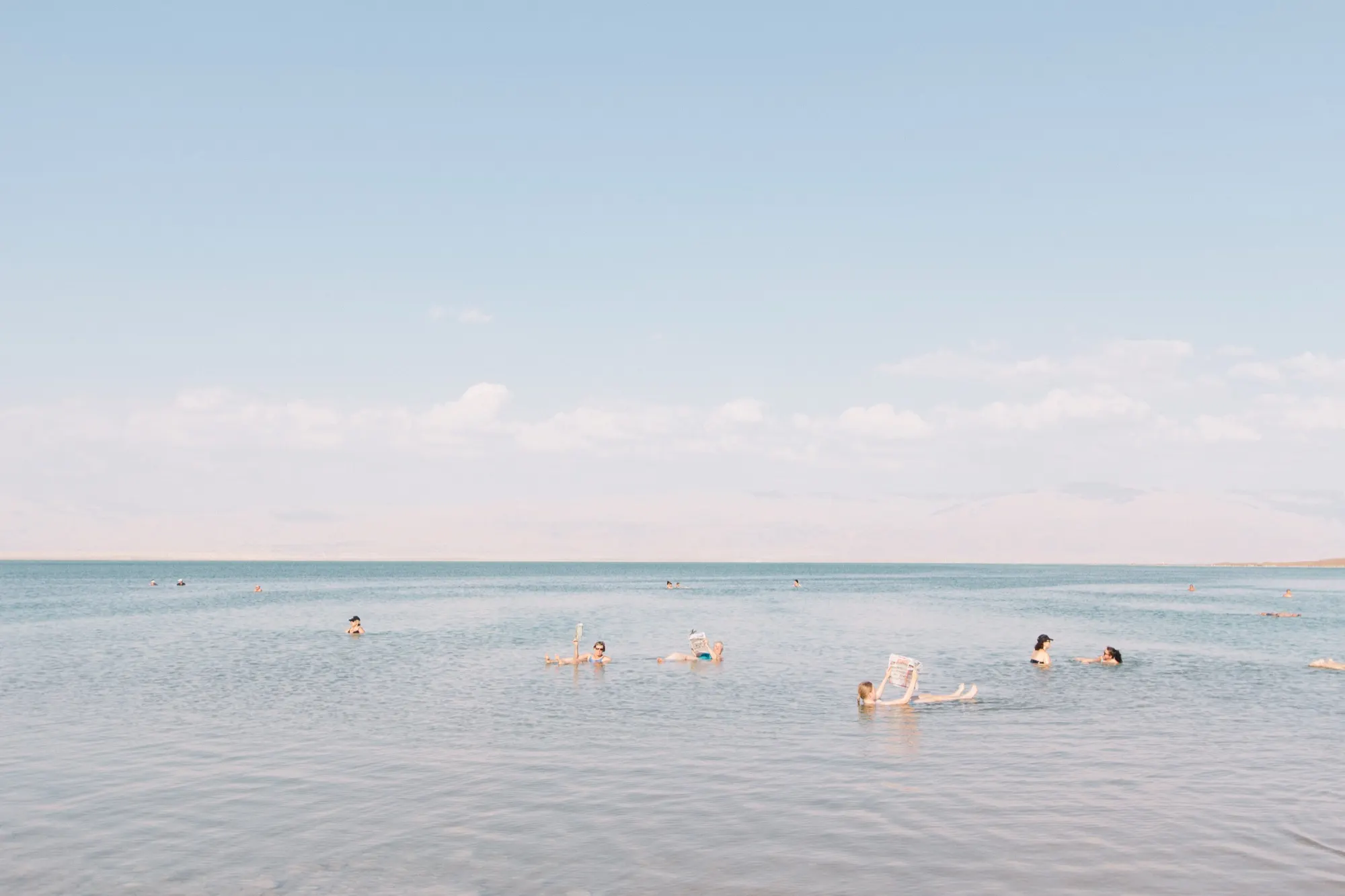 Bathers floating in the Dead Sea